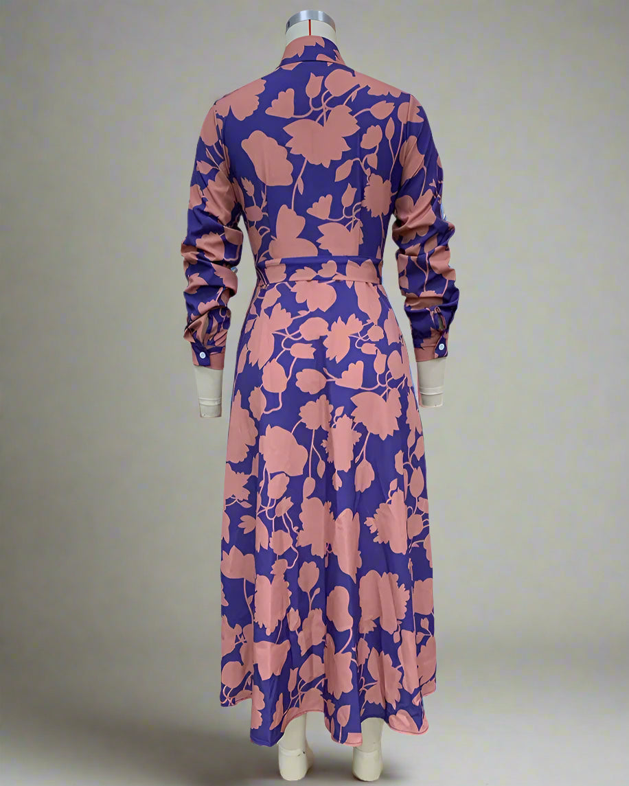 Floral patterned dress on a mannequin against a white background