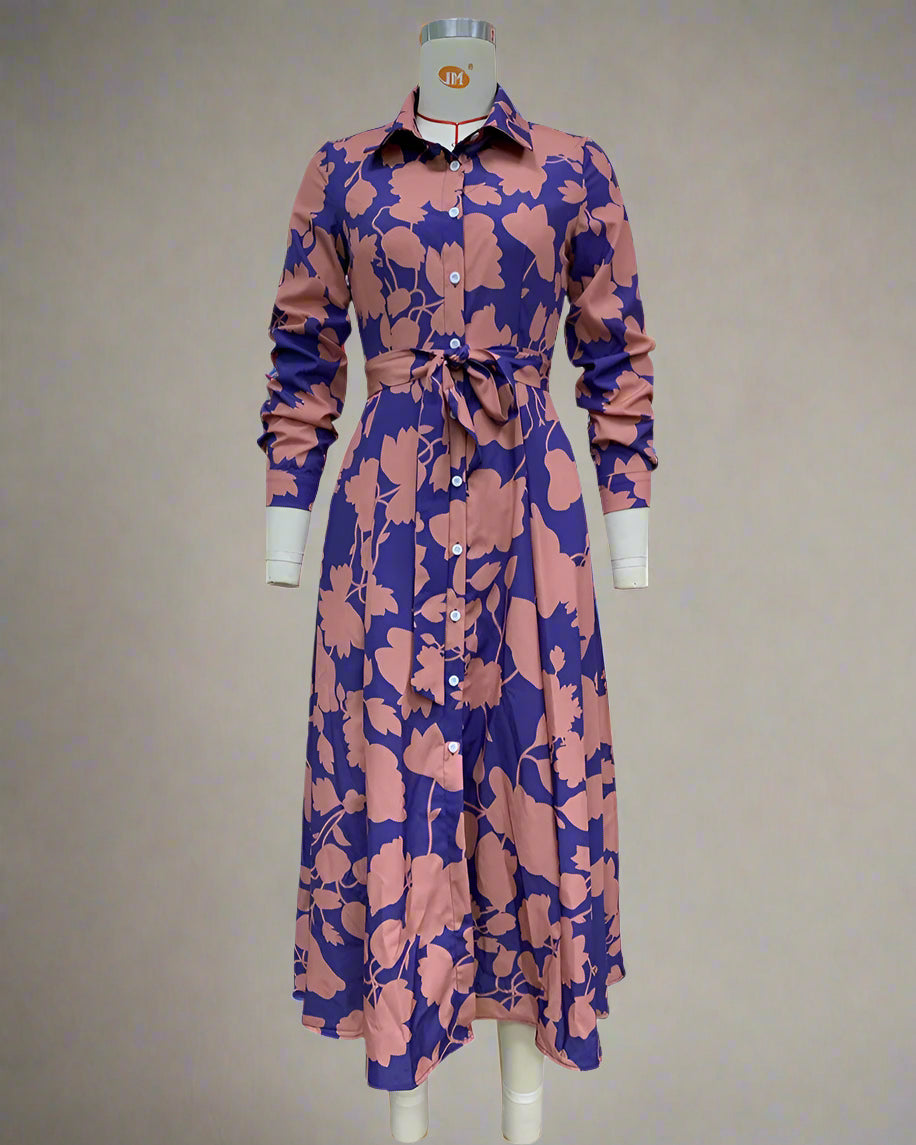 Long floral dress with pink and purple pattern on a mannequin against a white background