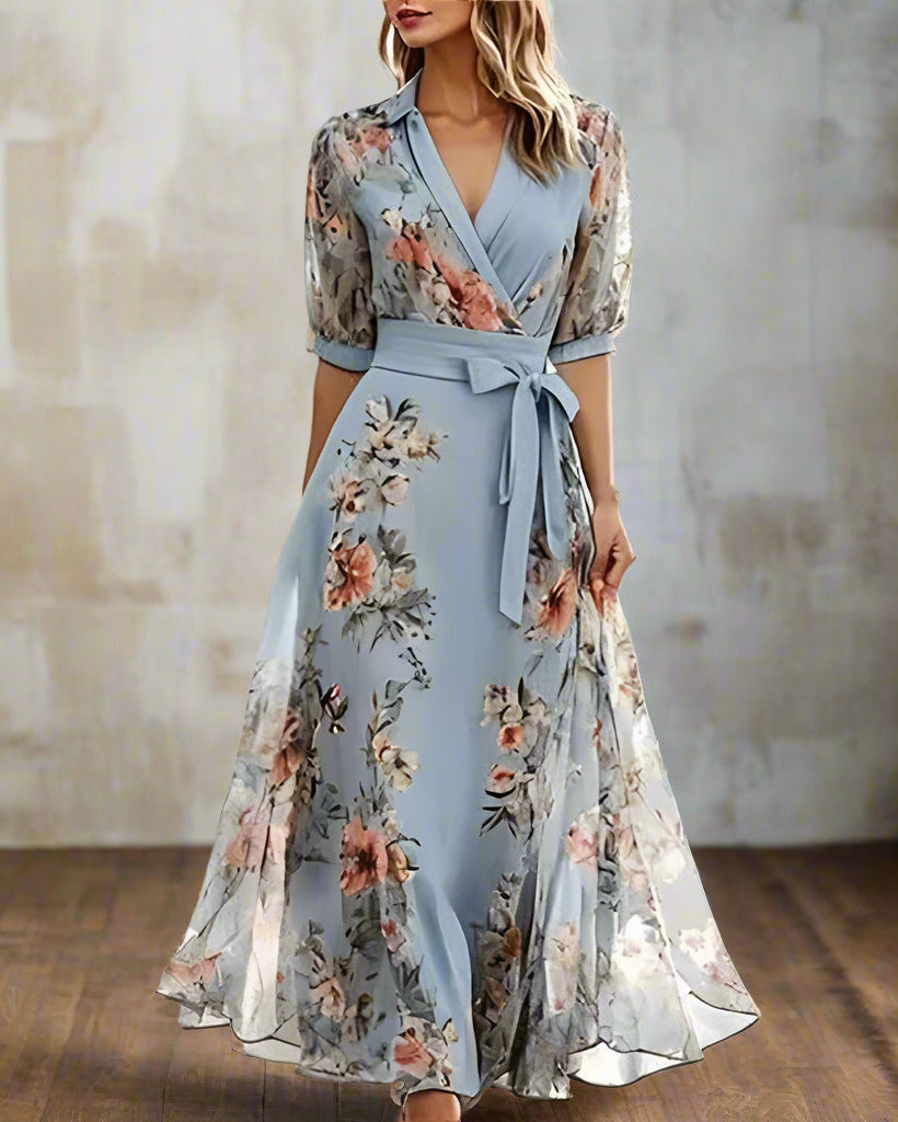 Woman wearing a floral dress with a blurred outdoor background