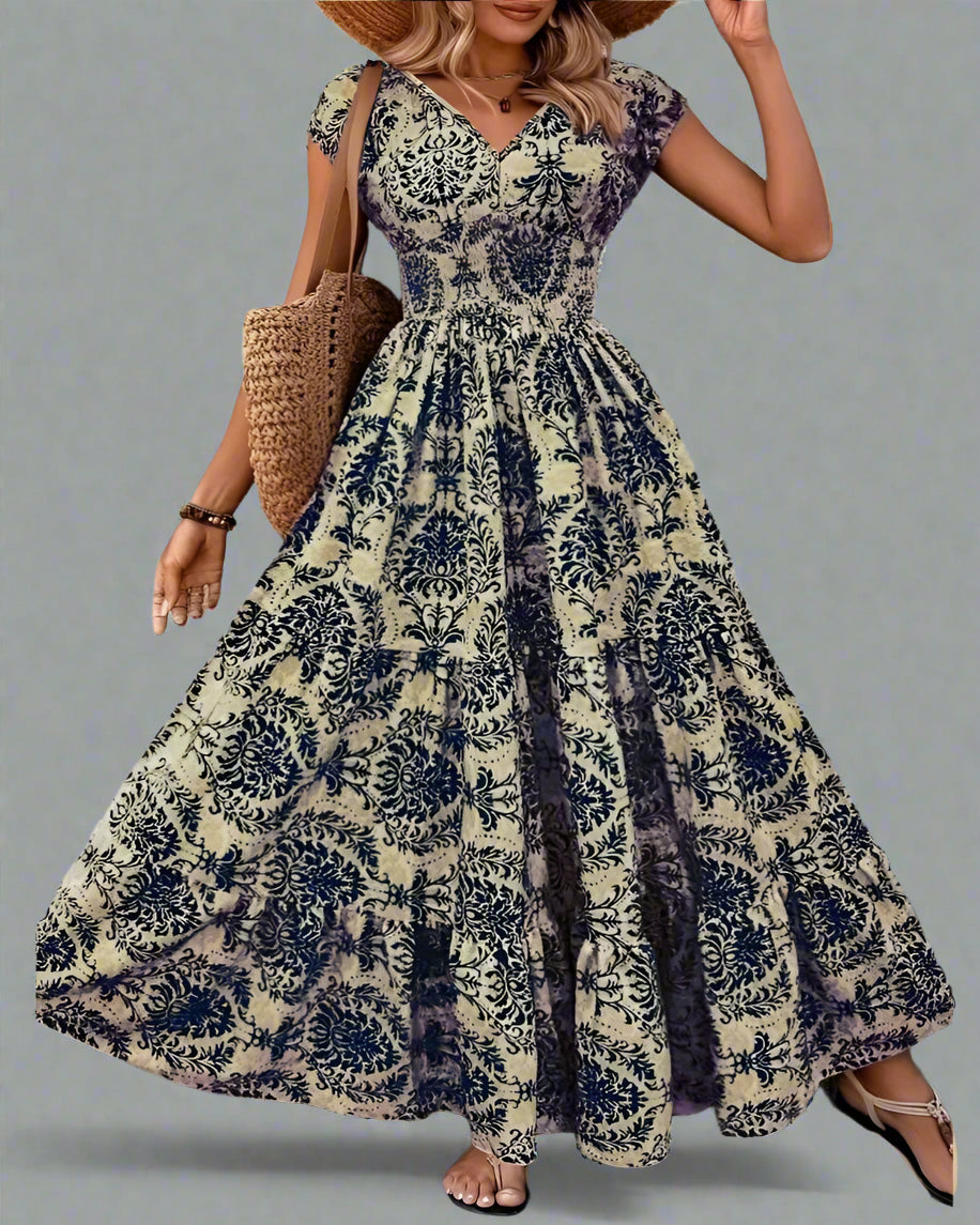Woman wearing a floral dress against a stone wall.