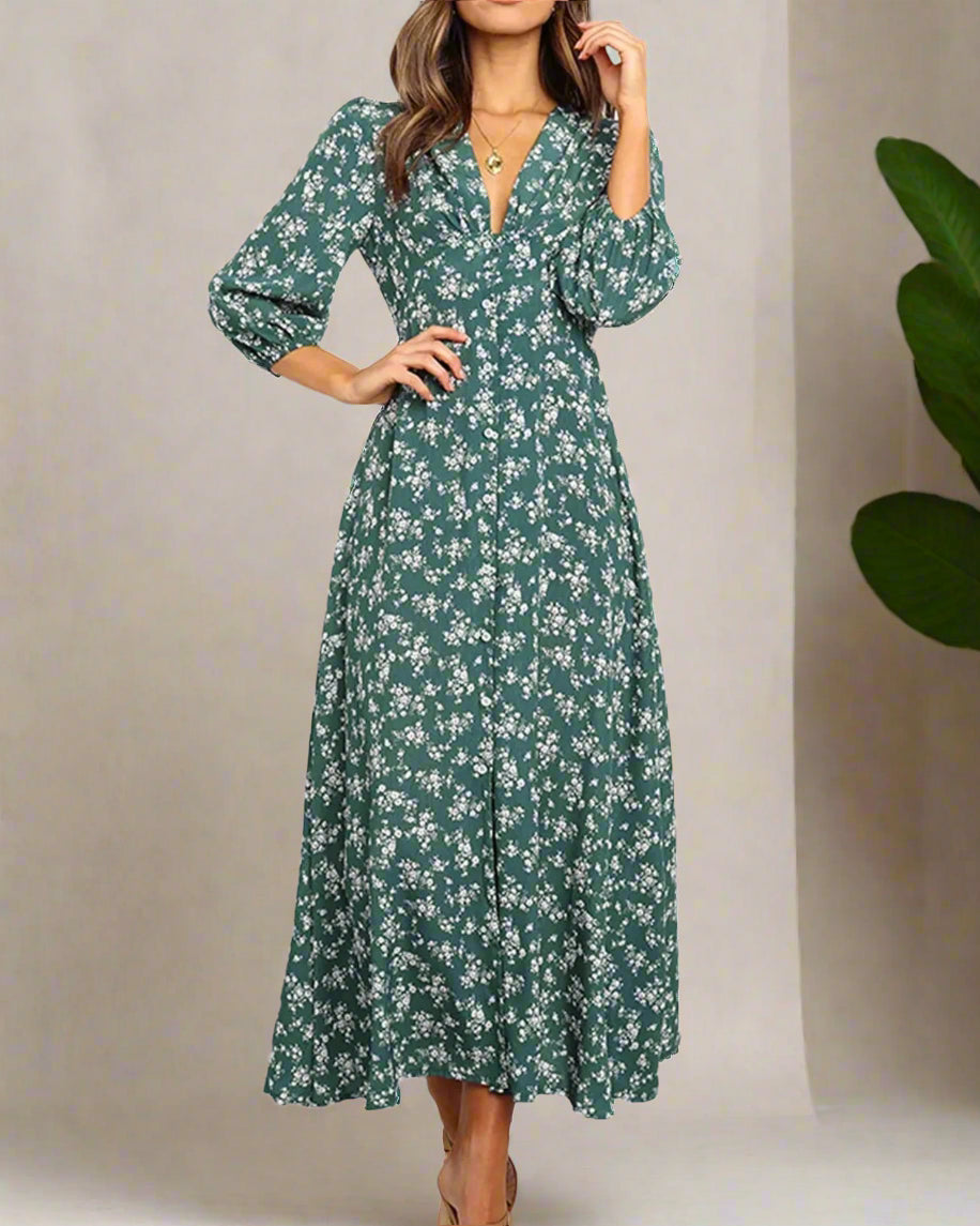 Green floral dress worn by a model on a white background