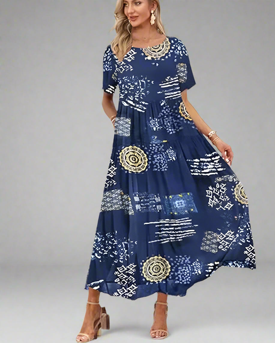 Woman wearing a blue patterned dress on a white background