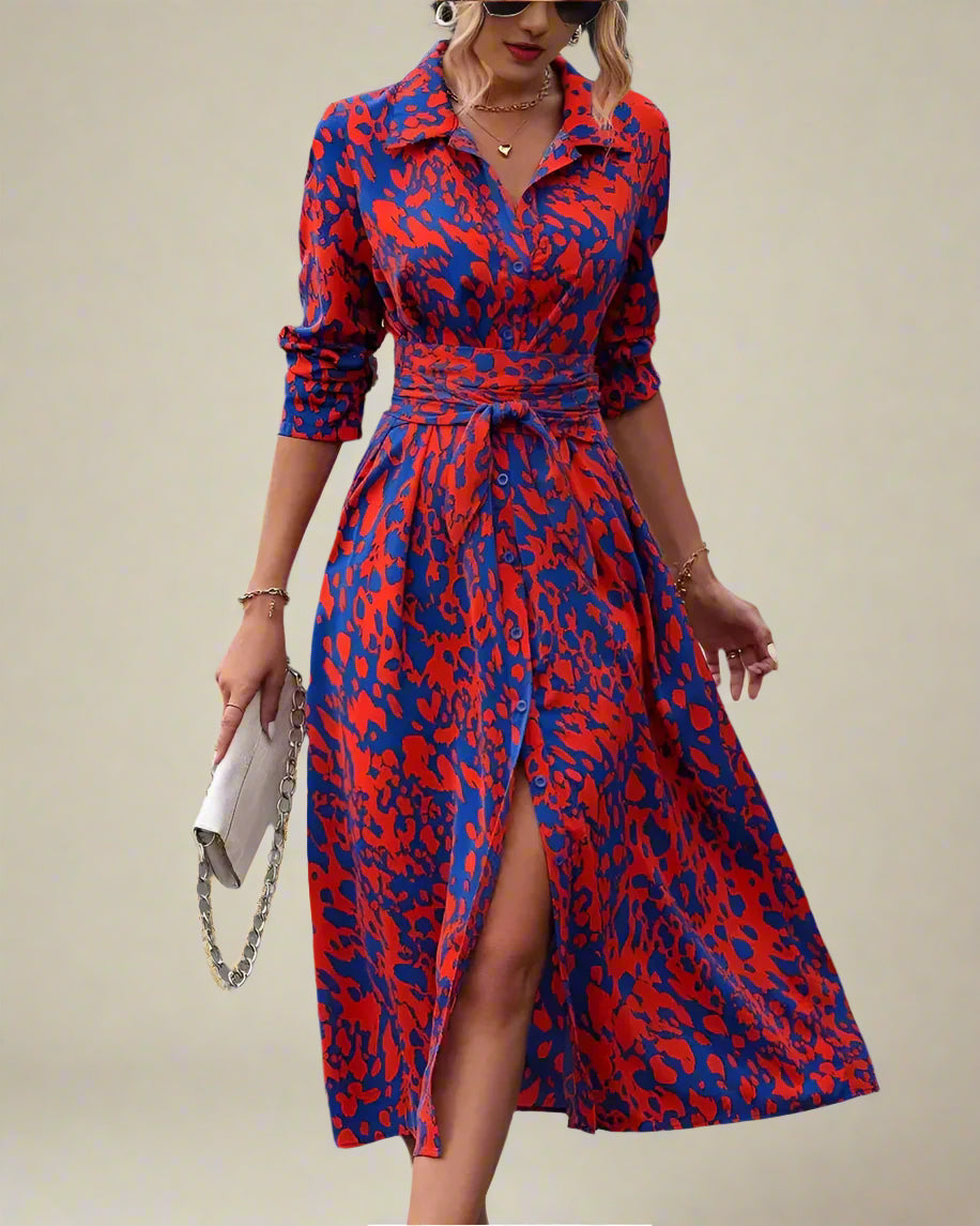 Woman wearing a red and blue patterned dress 